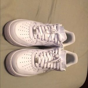 All white Air Force 1s low classics